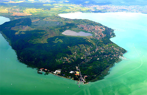 The flight will go as far as the Tihany peninsula, which is the most famous area of the Balaton region. Here you will witness the stunning Balaton Uplands National Park and the famous Tihany Abbey, which is truly a breathtaking sight from above.